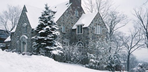 House surrounded by snow