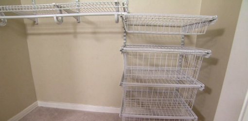 Wire baskets and shelves in closet.