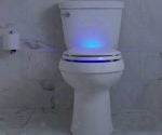 Toilet with blue light illumination in seat.
