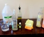 Cleaning supplies on wood table.