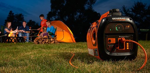 Family camping at night with portable generator.
