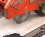 Wet saw cutting tile