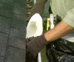 Cleaning gutters with scoop