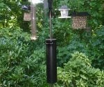 Homemade bird feeder baffle on pole