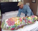Joe Truini demonstrating his trick for putting a duvet cover on a comforter.